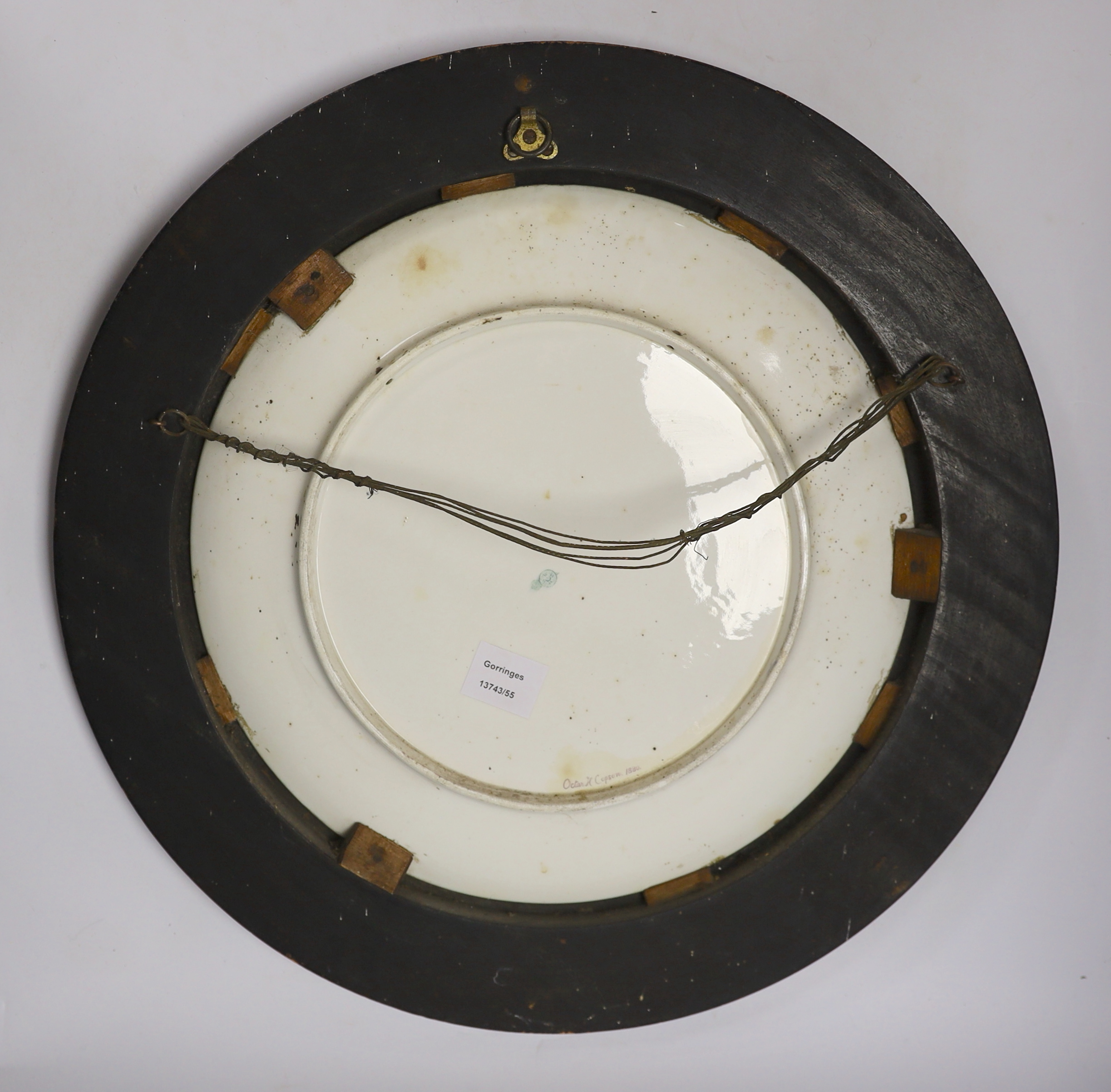 A framed Royal Worcester charger, outside painted by Octar H. Copson, dated 1880, 54cm total diameter